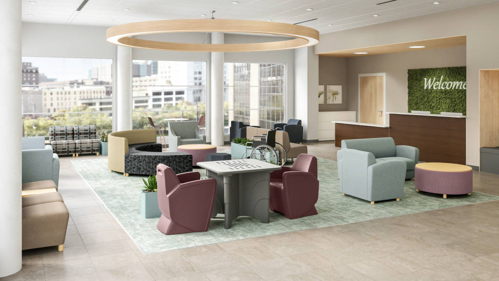 A photograph of a waiting room in a behavioral health facility which includes lounge seating and tables.